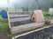 homemade chicken coop on the raised wooden bed. chicken tractor in the vegetable garden. hen house for cleaning the vegetable