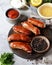 Homemade chicken turkey sausages fried on a cutting board with different types of sauce. picnic