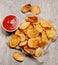 Homemade chips with tomato sauce. Potato chips
