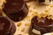 Homemade chocolate candies on rustic table, sweet food, macro photo