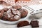 Homemade chocolate cookies with cracks. Biscuits with icing sugar