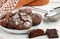 Homemade chocolate cookies with cracks. Biscuits with icing sugar