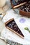 Homemade chocolate cream tart with blackberry jelly and walnuts