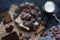 Homemade chocolate crinkles in powdered sugar, chocolate cookies with cracks and a glass of milk