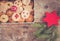 Homemade Christmas cookies: Delicious cookies and Christmas bauble are stored in a metal box, rustic wooden background