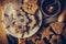 Homemade Christmas gingerbread and linzer cookies with jam, powdered, top flat view, soft haze effect, vintage