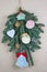 Homemade Christmas tree branch decoration of toys   made of wood, plaster and  bows