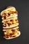 Homemade Cleveland Polish Boy Sandwich on a rustic wooden board on a black background, view from above. Top view, overhead, flat