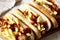 Homemade Cleveland Polish Boy Sandwich on a rustic wooden board on a white wooden background, low angle view. Close-up