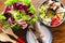 Homemade cobb salad on a rustic wood surface