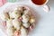 Homemade coconut balls decorated with little pink flowers