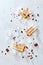 Homemade coffee ice cream with caramel and coffee beans on a wooden stick over marble and ice background, top view