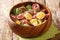 Homemade colored tortellini dumplings with various fillings close-up in a bowl. horizontal