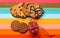 Homemade and consumer cookies on colorful as rainbow background. Biscuits concept. Comparison of manufactured and