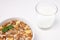 Homemade cooked oatmeal cereals with ceramic mug and glass of milk on white background horizontal