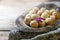 Homemade cookies in the form of nuts filled with sweet condensed milk on an old wooden background. Homemade Russian cookies