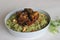 Homemade Coriander pulao, a one pot rice preparation in ghee with onions, green chutney and whole spices. Served with mutton roast