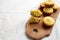 Homemade Cornbread Muffins on a rustic wooden board, side view. Copy space