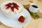 Homemade cottage cheese with fresh strawberries, mint leaves decoration