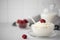 homemade cottage cheese with milk and raspberries in a glass bowl