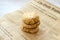 Homemade cottage cheese pancakes syrniki stack on retro baking paper newspaper on white background