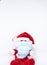 Homemade cotton Santa Claus play with a Covid-19 or Coronavirus protection mask