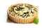 Homemade courgette and feta quiche isolated on white