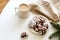 Homemade Cracked chocolate marble cookies for Christmas and cup tea with milk on table. Traditional American chocolate cookies for