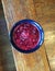 Homemade Cranberry Sauce in a Blue Bowl on a Bench