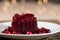 Homemade cranberry sauce on white plate