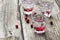 Homemade cranberry vodka, wooden background