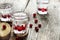 Homemade cranberry vodka, wooden background