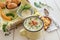 Homemade cream of potato soup with croutons and thyme, served wi
