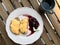 Homemade Creamy Scrambled Eggs in Breakfast Plate with Toast Bread, Cheese and Blackberry Jam