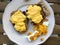 Homemade Creamy Scrambled Eggs in Breakfast Plate with Toast Bread, Cheese Cherry and Orange Jam / Marmalade