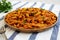 Homemade Creamy Tomato Shrimp Rotini Pasta with Parsley on a Plate, low angle view. Close-up