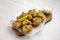 Homemade crispy japanese fried chicken Karaage on a rustic wooden board over white wooden background, low angle view. Closeup