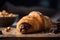 homemade croissant, filled with chocolate hazelnut spread and topped with toasted hazelnuts