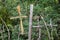 Homemade cross made with planks and hays