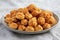 Homemade Crumbly Biscuits with Parmigiano Reggiano on a Plate, side view. Close-up