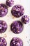 Homemade cupcakes made of purple cream for fat thursday