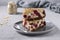 Homemade curd cheese casserole with oatmeal and cherry on a gray plate on light gray background, Closeup