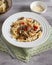 Homemade curly pasta with mushrooms and parmesan cheese