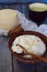 Homemade dairy products: cottage cheese, milk whey and young cheese on wooden background