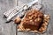 Homemade date and walnut loaf cake on old wooden table