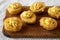 Homemade Deep-fried Deviled Eggs with Paprika on a rustic wooden board, side view. Close-up