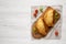 Homemade Deep Fried Italian Panzerotti Calzone on a rustic wooden board on a white wooden background, top view. Flat lay, overhead