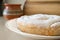 Homemade delicious rustic cherry pie closed with powdered sugar