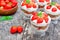 Homemade desert with cream chopped cookies and fresh strawberry