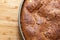 Homemade diet cake  in a baking dish on a wooden board